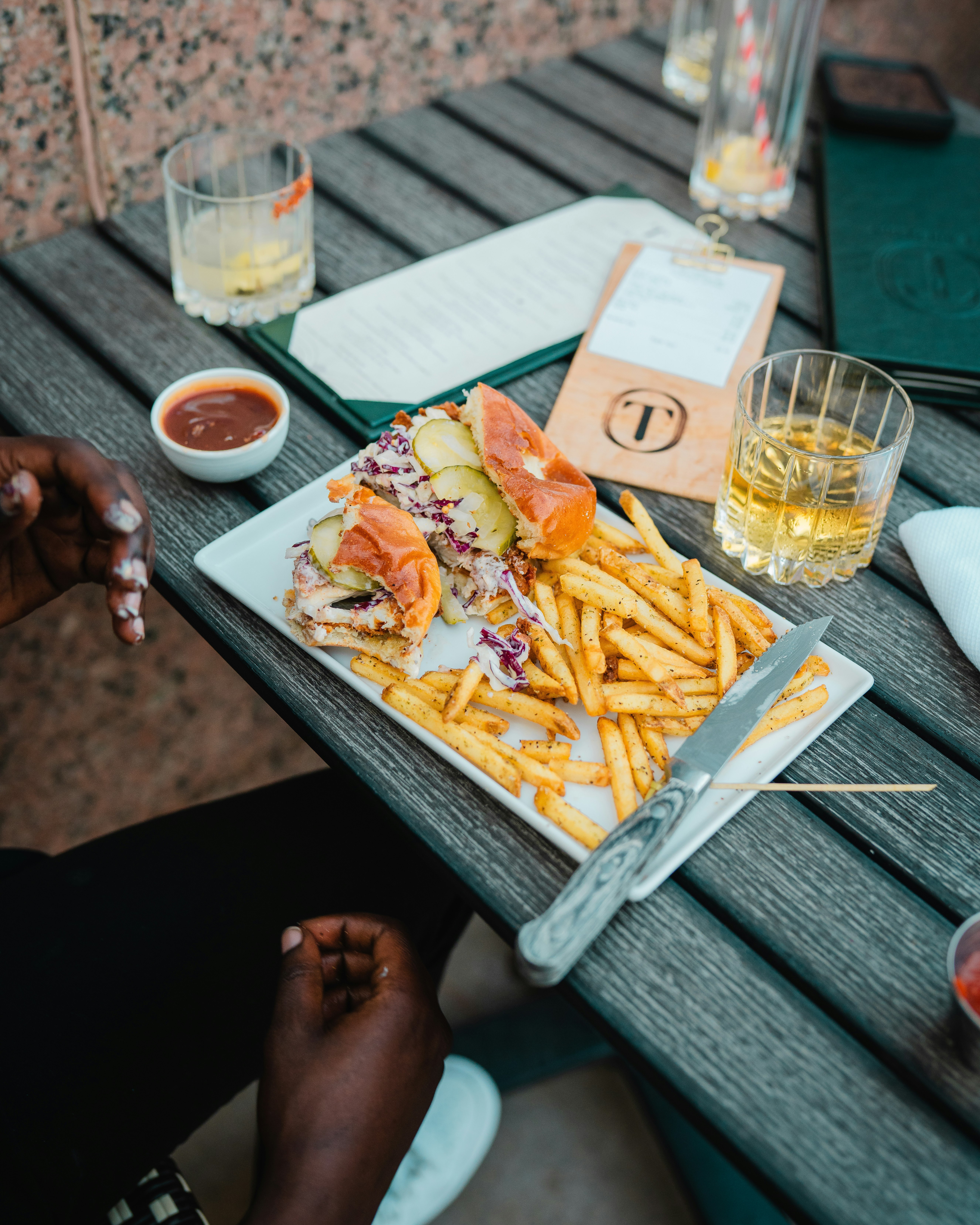 person holding white ceramic plate with food on it